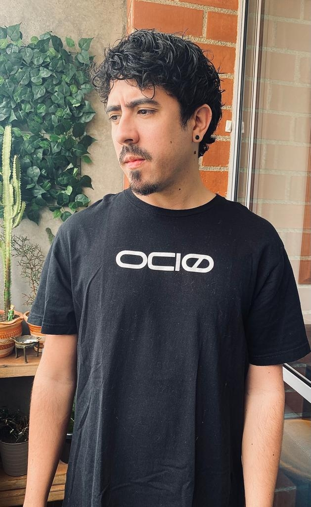 Archaic Revival  in a black shirt prominently on the front.